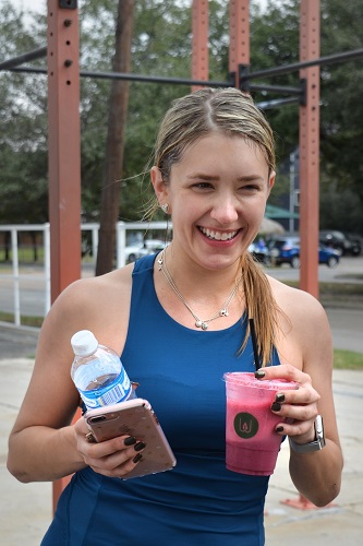 Athlete Drinking Smoothie and Water